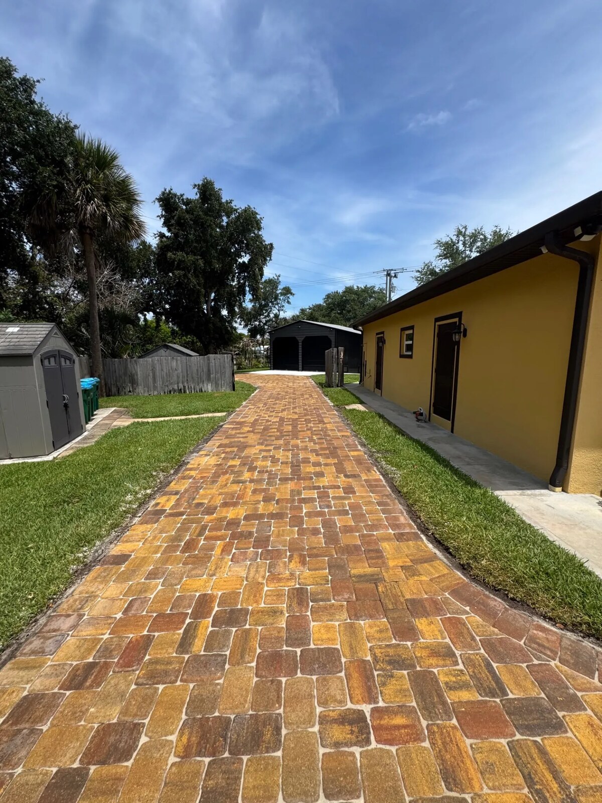 Completed paver walkway leading to a home entrance in Melbourne, Brevard County